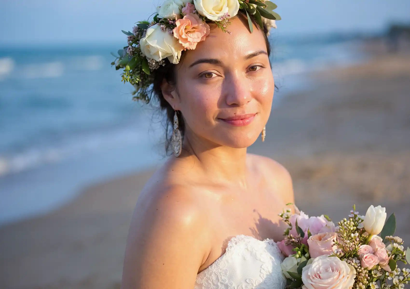 A radiant bride with glowing skin wearing a floral crown and holding a bouquet on the beach, showcasing the results of skincare treatments from a beauty clinic bali